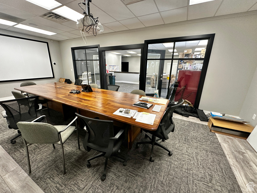 Office space featuring carpet floors and a drop ceiling