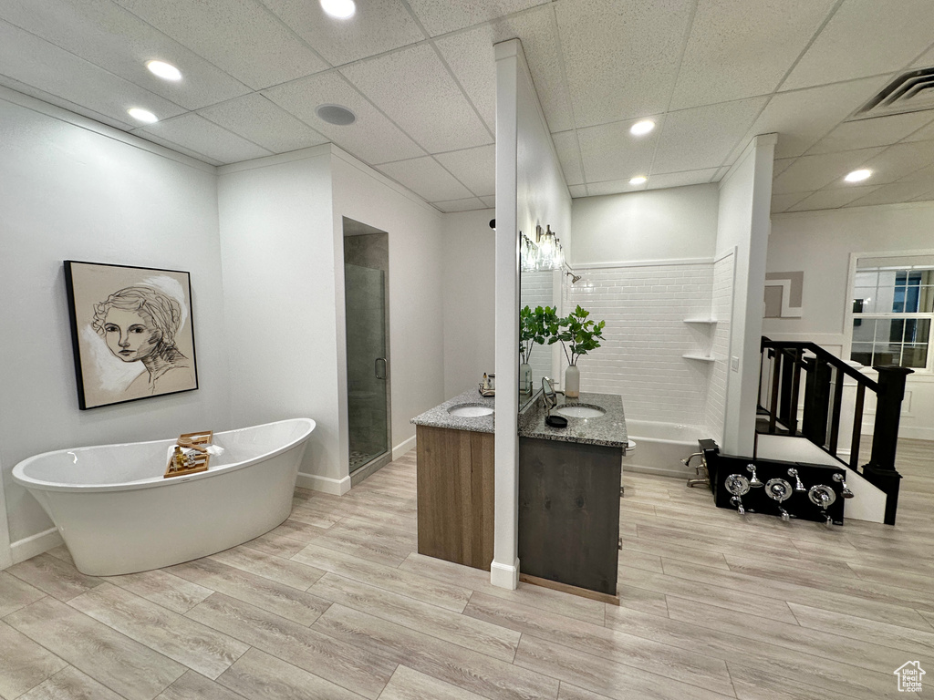 Bathroom with plus walk in shower, a paneled ceiling, and vanity