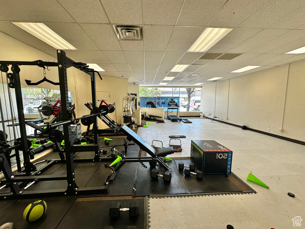 Gym with a paneled ceiling