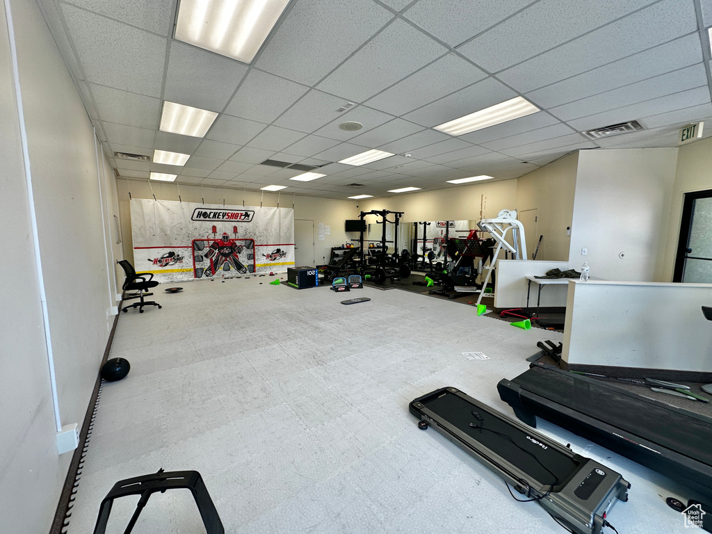 Workout area featuring a drop ceiling