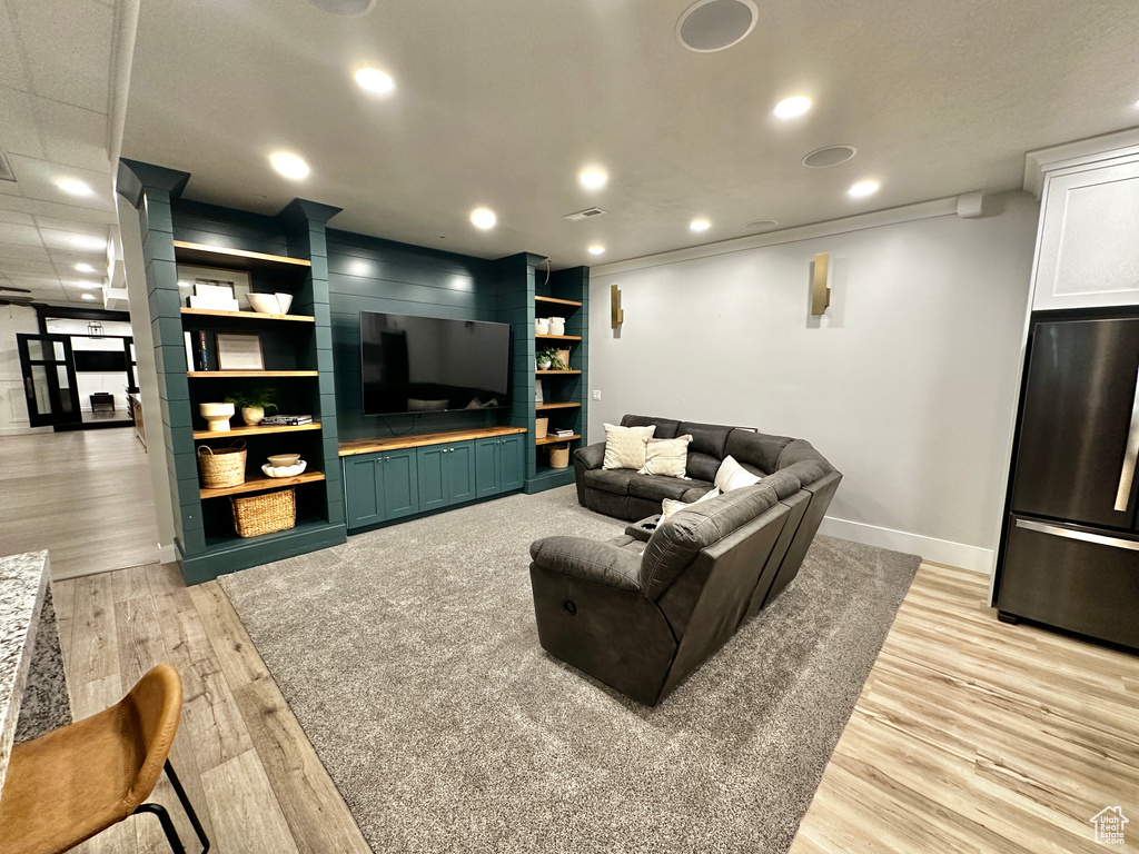 Living room with light hardwood / wood-style flooring