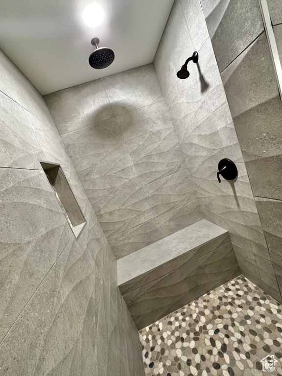 Bathroom featuring tiled shower