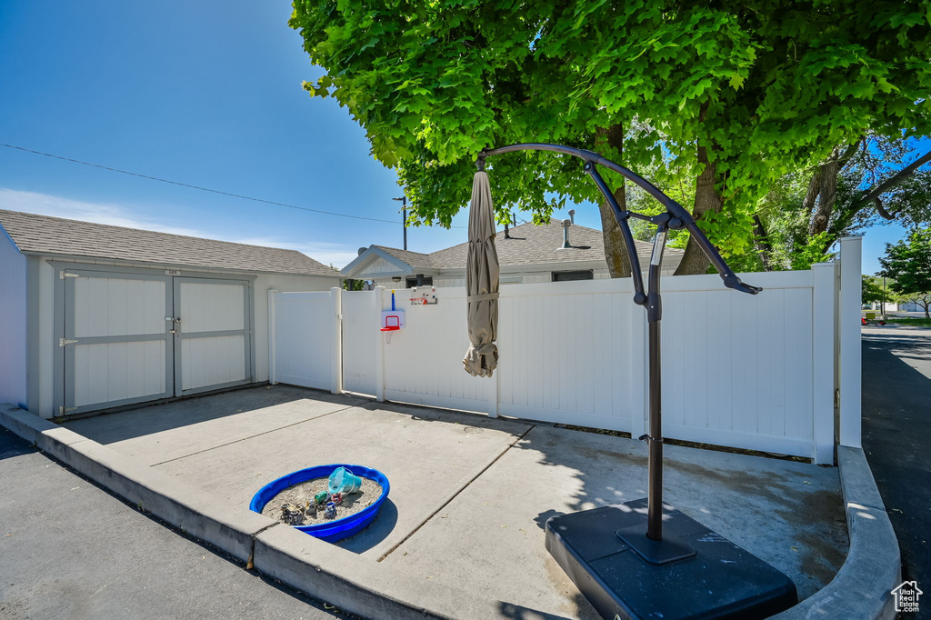 View of patio / terrace with a storage shed