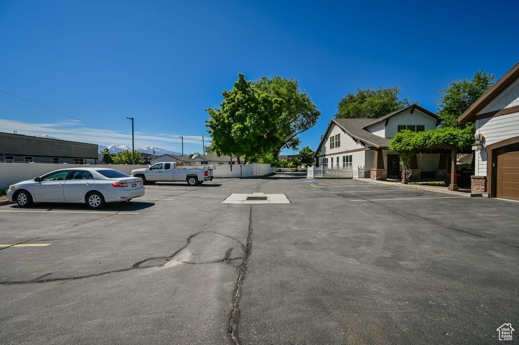 View of car parking featuring a garage