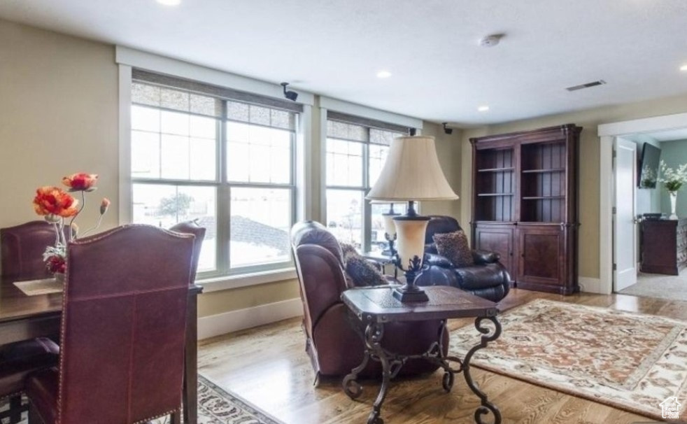 Office area with light hardwood / wood-style flooring