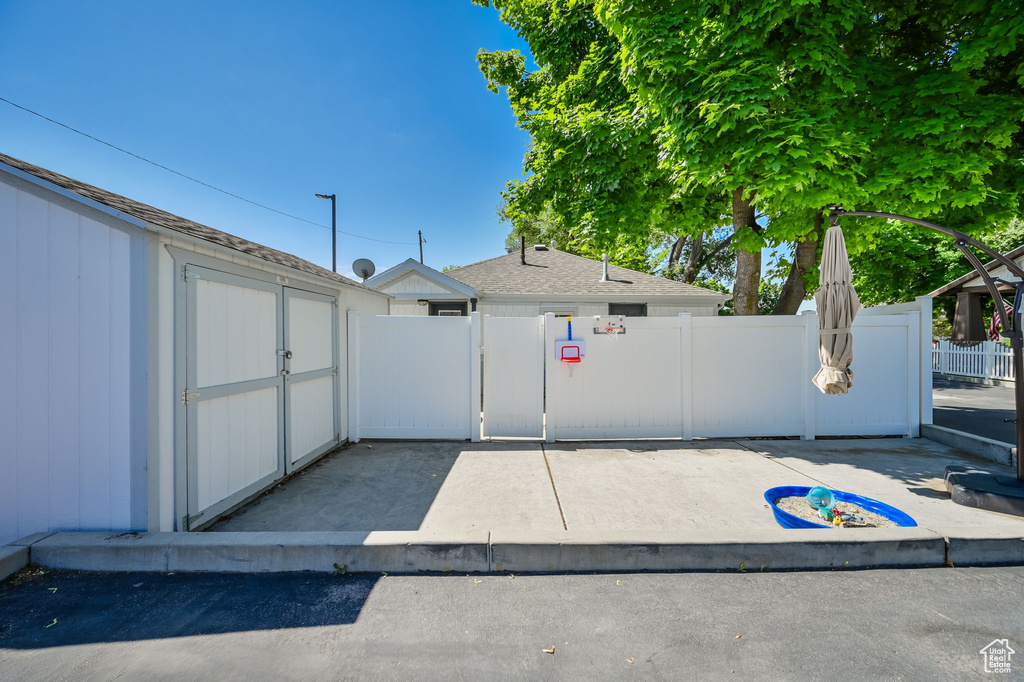 Exterior space with a storage shed