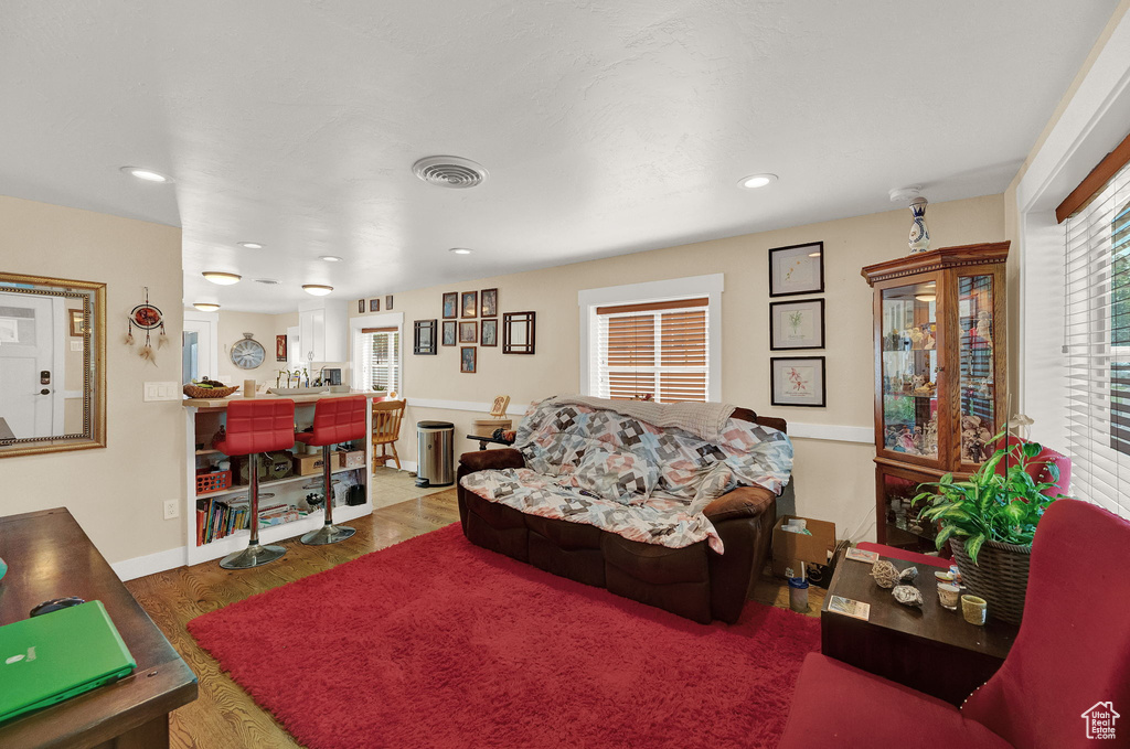 Living room with wood-type flooring