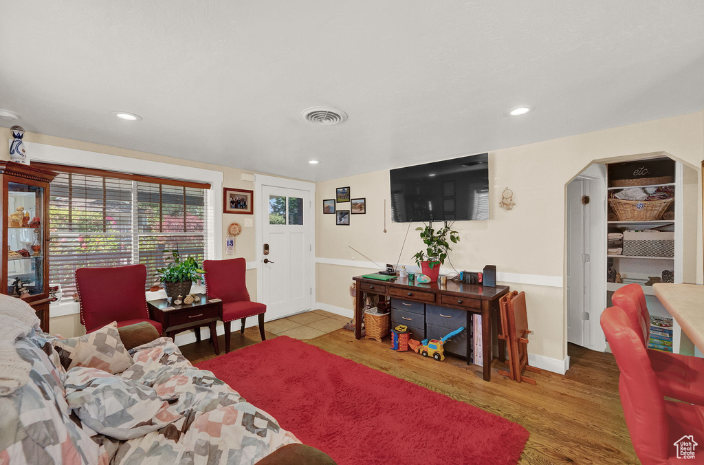 Living room with hardwood / wood-style flooring