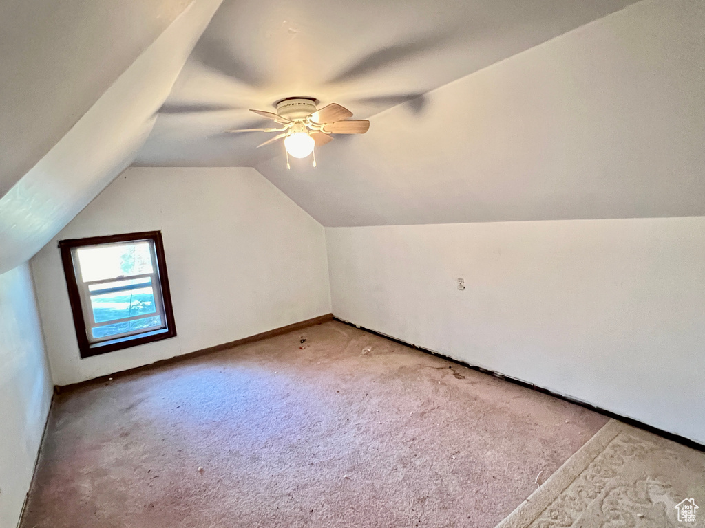 Bonus room with carpet, ceiling fan, and vaulted ceiling