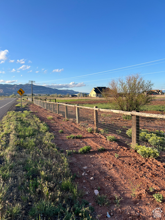 View of yard with a mountain view and a rural view