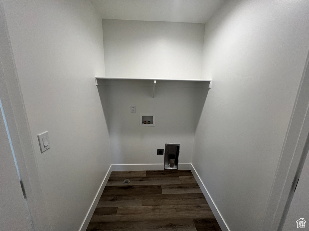 Laundry room with dark hardwood / wood-style floors and hookup for a washing machine