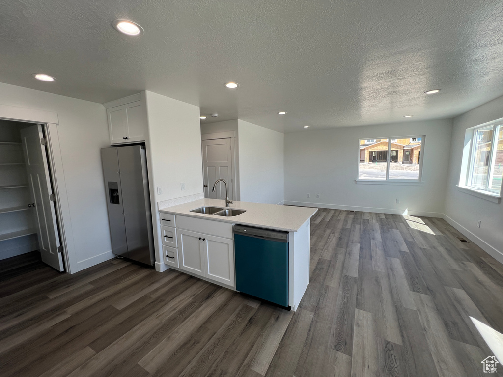 Kitchen featuring stainless steel fridge with ice dispenser, white cabinets, dishwasher, and dark wood-type flooring