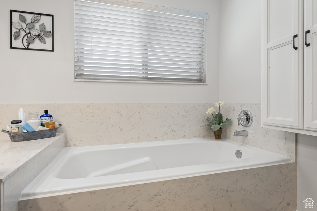 Bathroom with a relaxing tiled bath