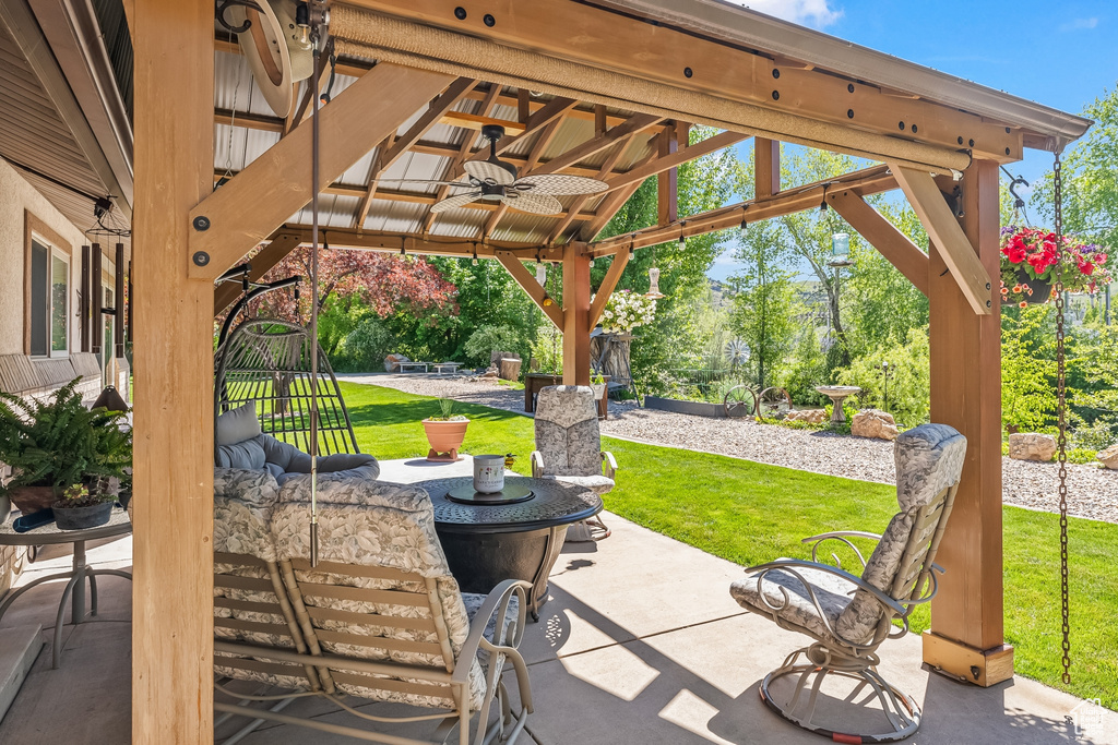 View of patio featuring a gazebo and ceiling fan