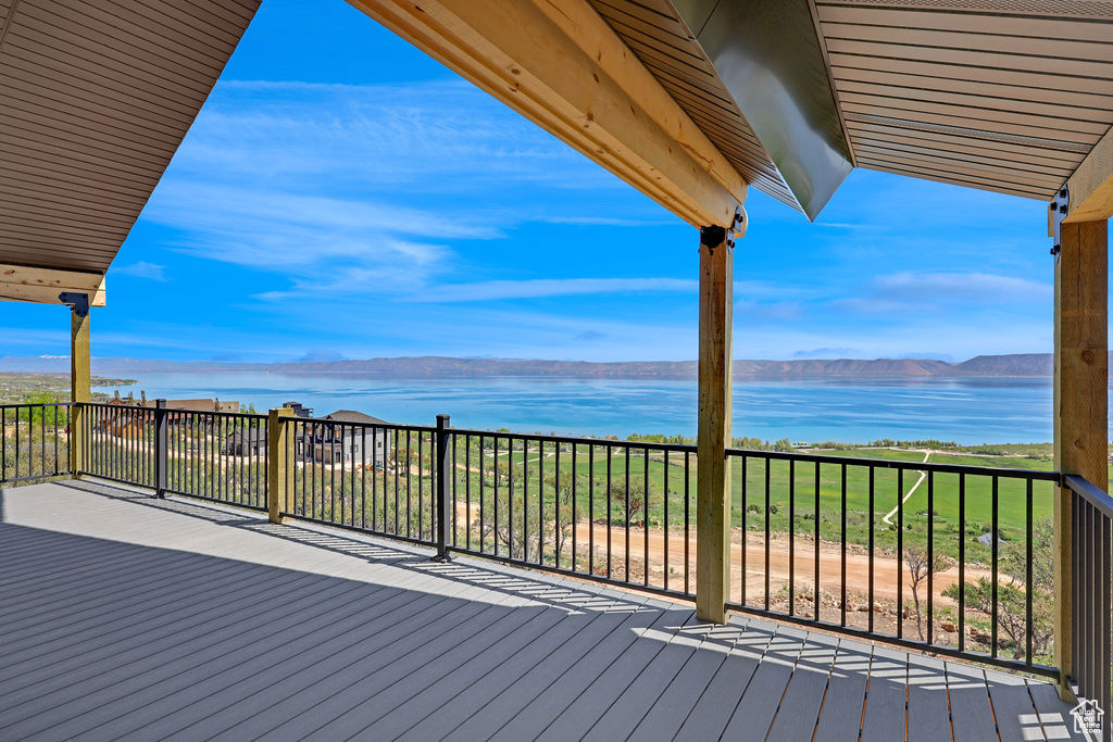 Wooden terrace with a water and mountain view