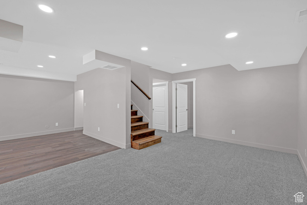 Basement featuring light hardwood / wood-style floors