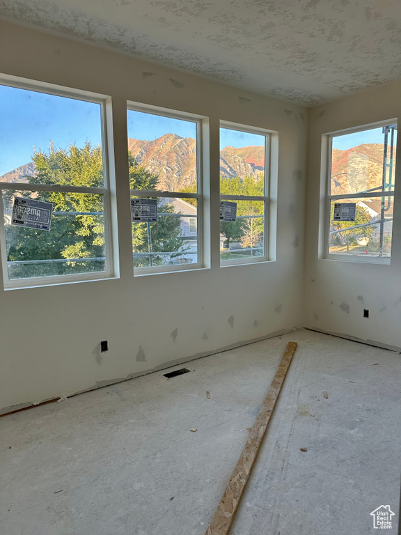 Empty room featuring a mountain view