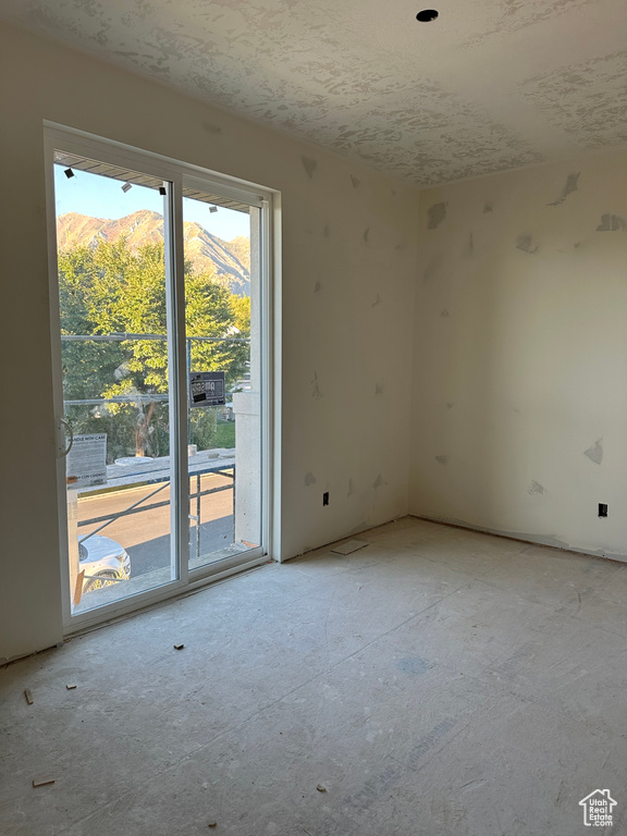 Spare room featuring a mountain view