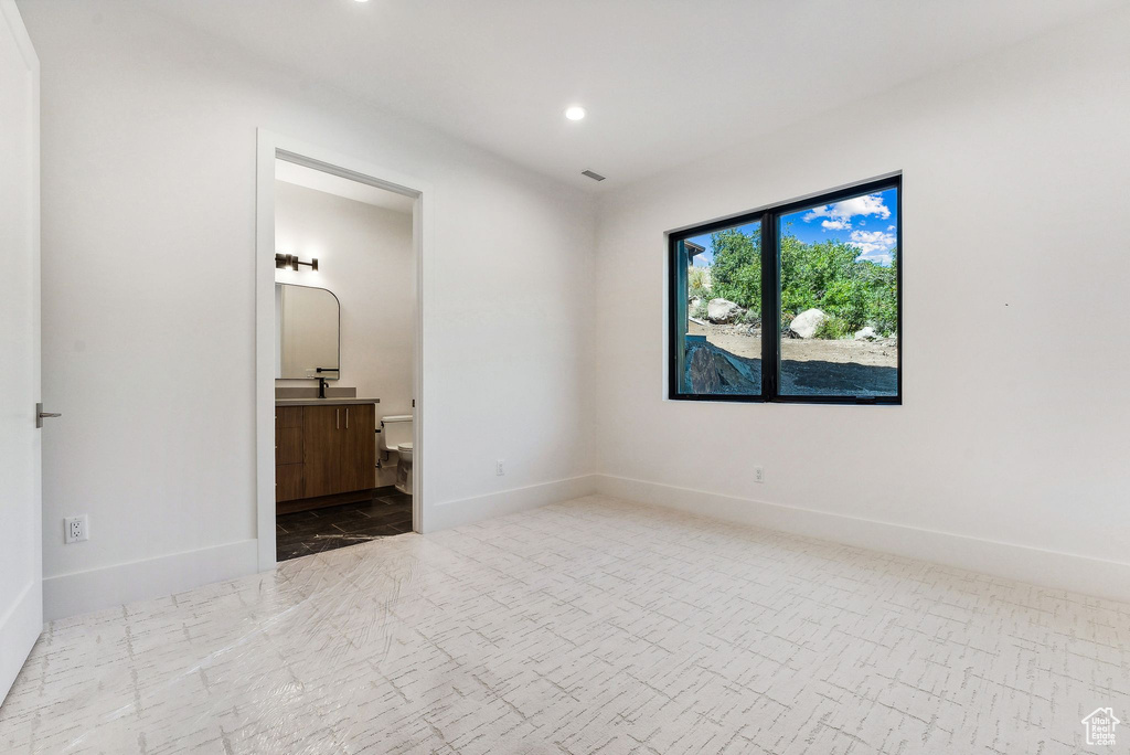 Unfurnished bedroom with ensuite bathroom