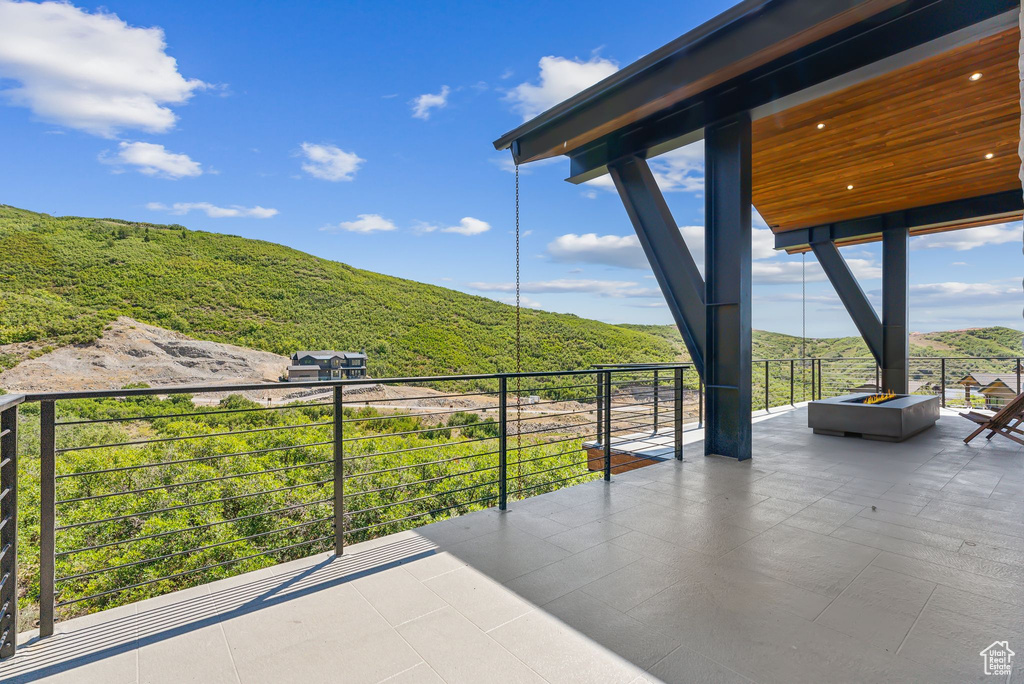 View of patio / terrace featuring a balcony and a mountain view