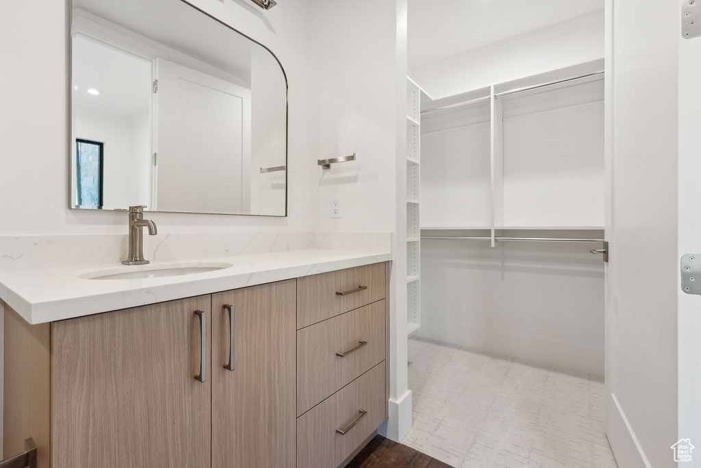 Bathroom featuring vanity and hardwood / wood-style flooring