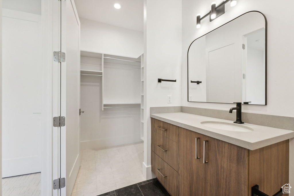 Bathroom with vanity and tile patterned floors