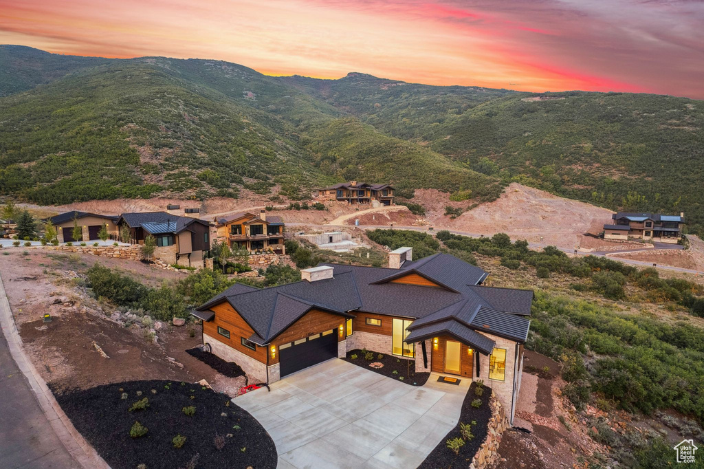 Aerial view at dusk featuring a mountain view