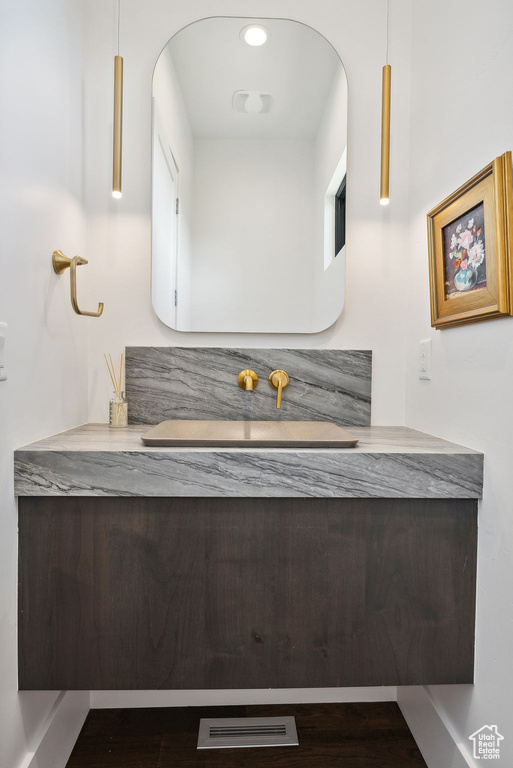 Bathroom with wood-type flooring and vanity