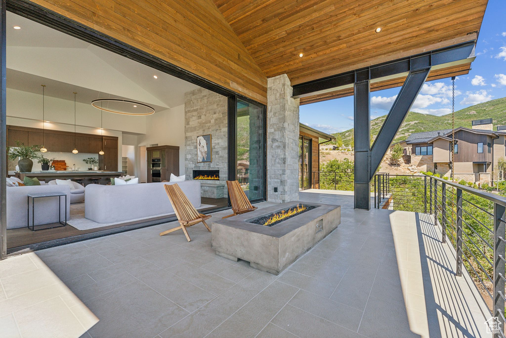 View of patio / terrace with an outdoor stone fireplace