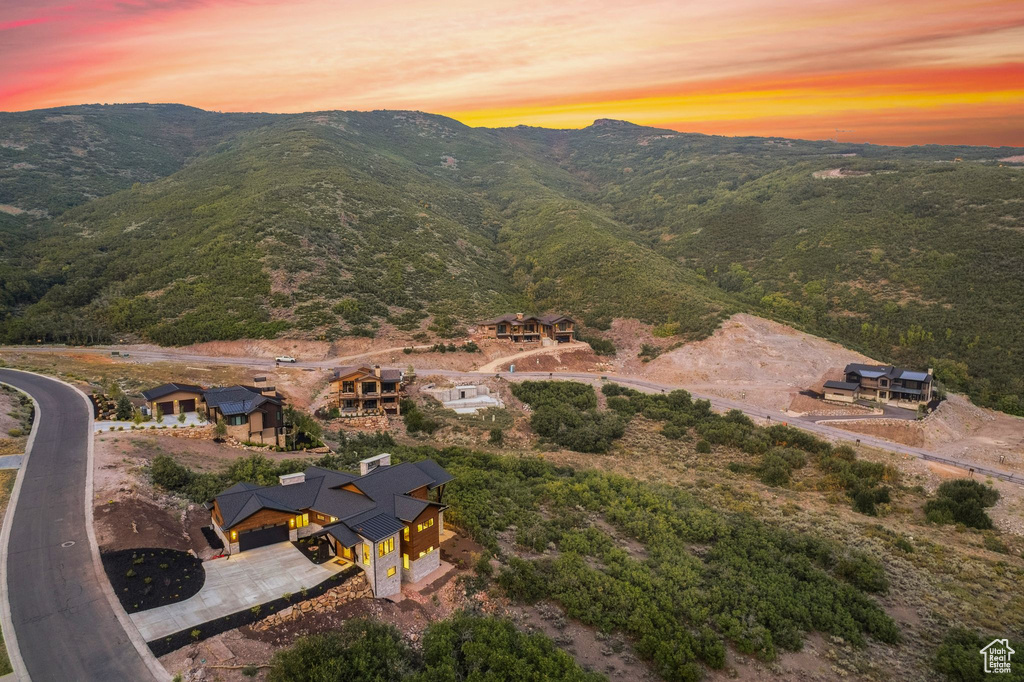 Aerial view at dusk featuring a mountain view