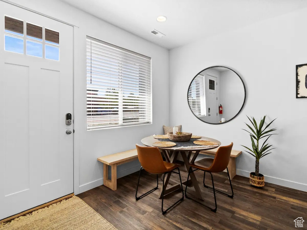 Dining space featuring dark wood-type flooring