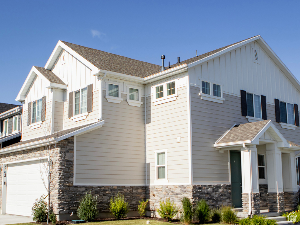 View of side of property featuring a garage