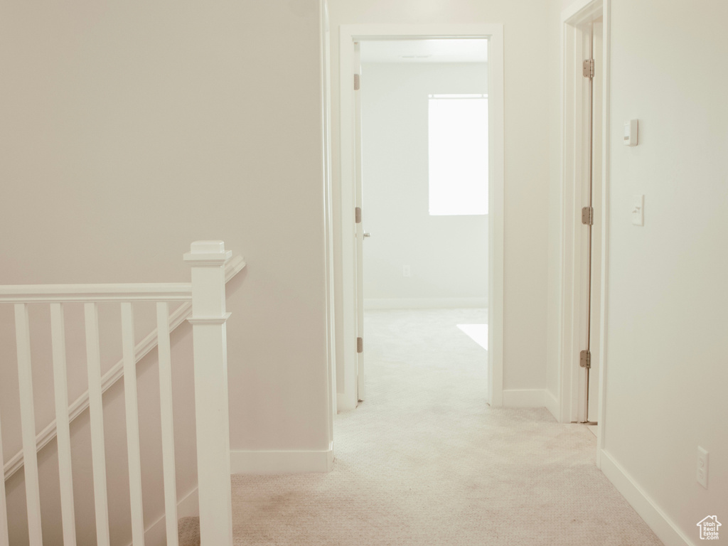 Hall featuring carpet flooring