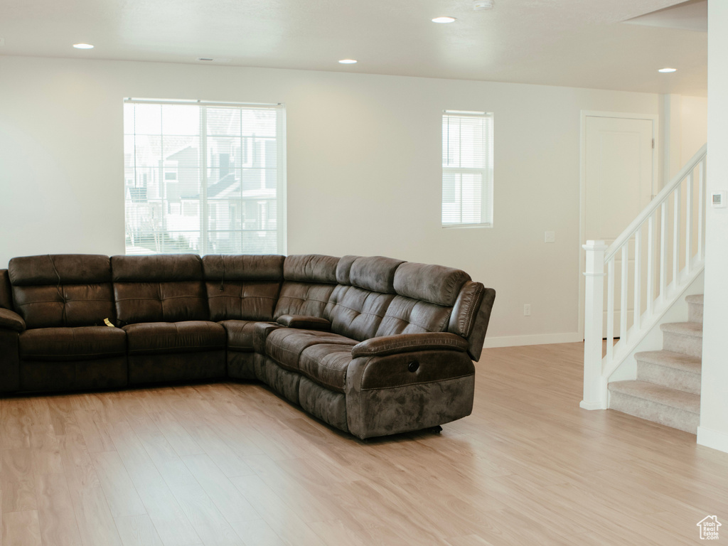 Living room featuring a healthy amount of sunlight and light wood-type flooring