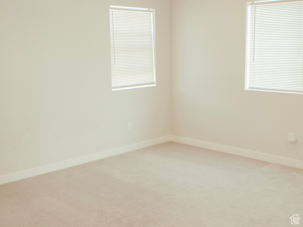 Empty room with carpet flooring