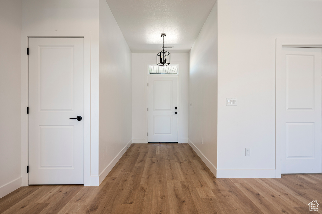 Hallway featuring light wood-type flooring