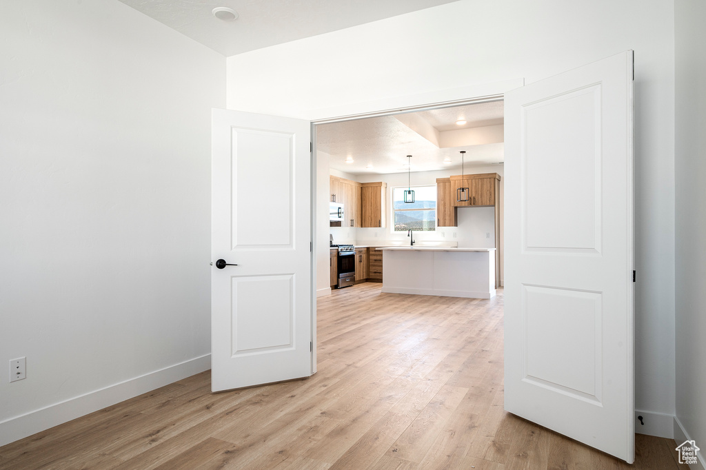 Unfurnished living room featuring light hardwood / wood-style flooring