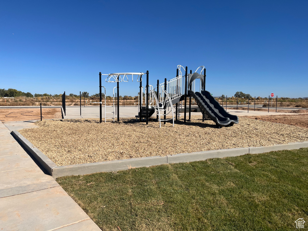 View of play area featuring a lawn