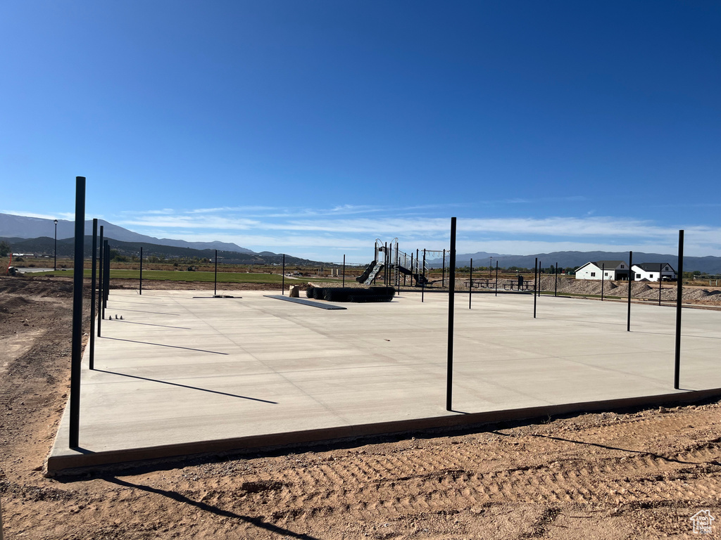 Exterior space featuring a mountain view and a playground