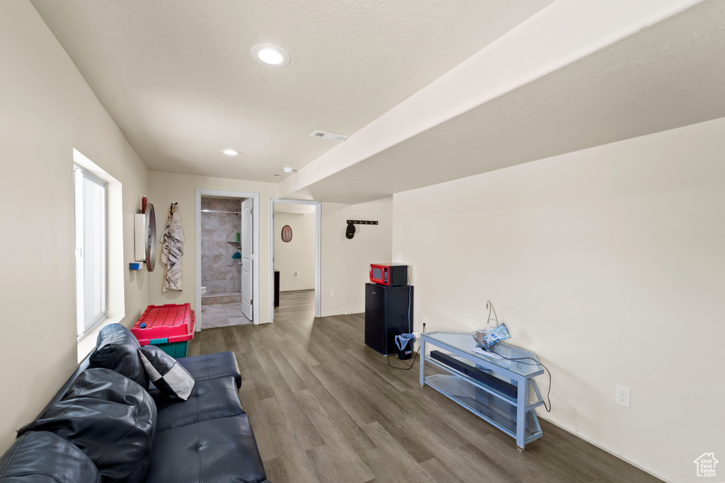 Living room featuring hardwood / wood-style floors and plenty of natural light