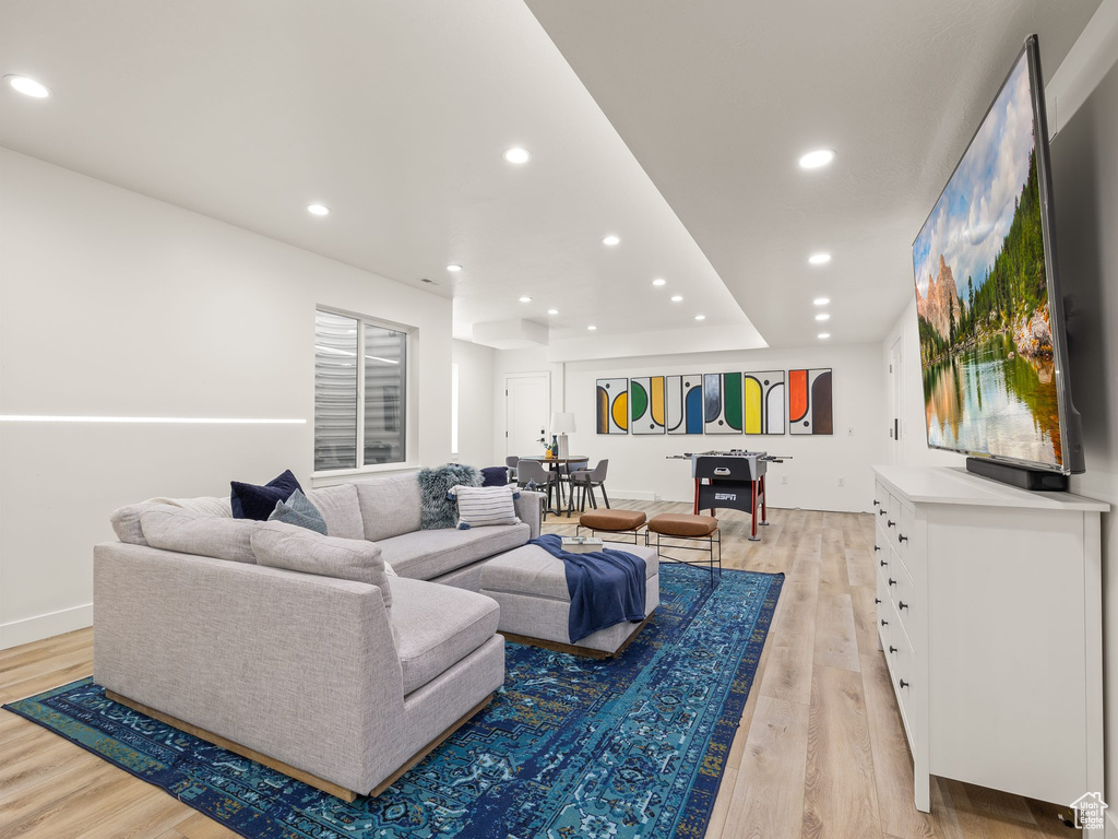 Living room with light wood-type flooring