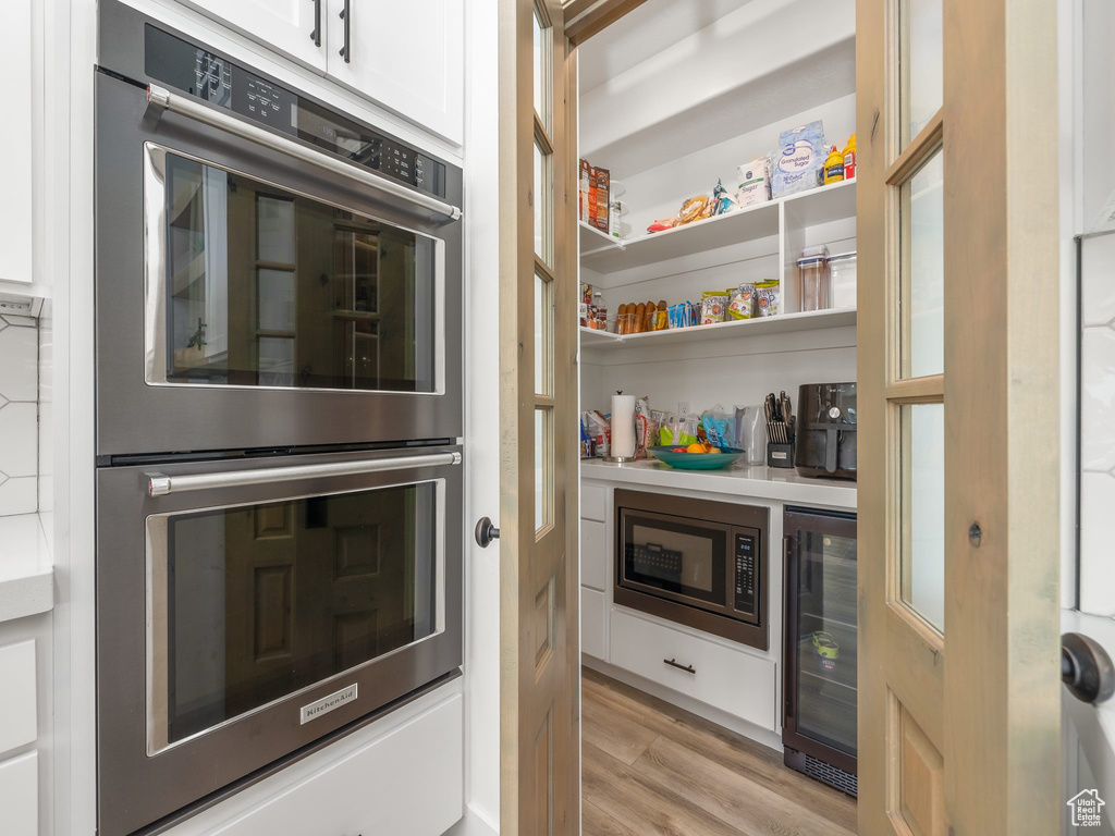 Pantry featuring wine cooler