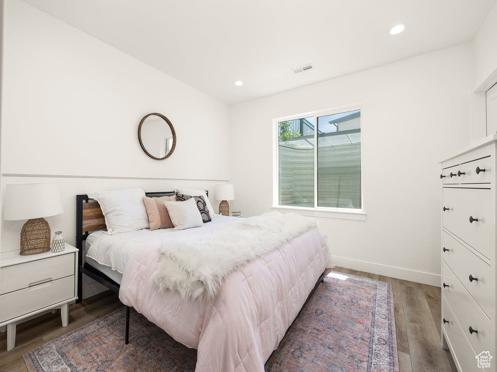 Bedroom featuring hardwood / wood-style flooring