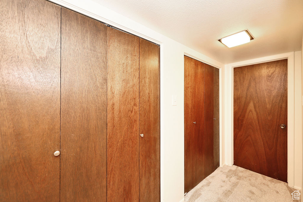 Hallway with a textured ceiling