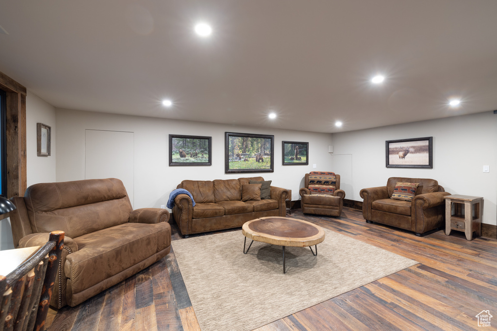 Living room with hardwood / wood-style flooring