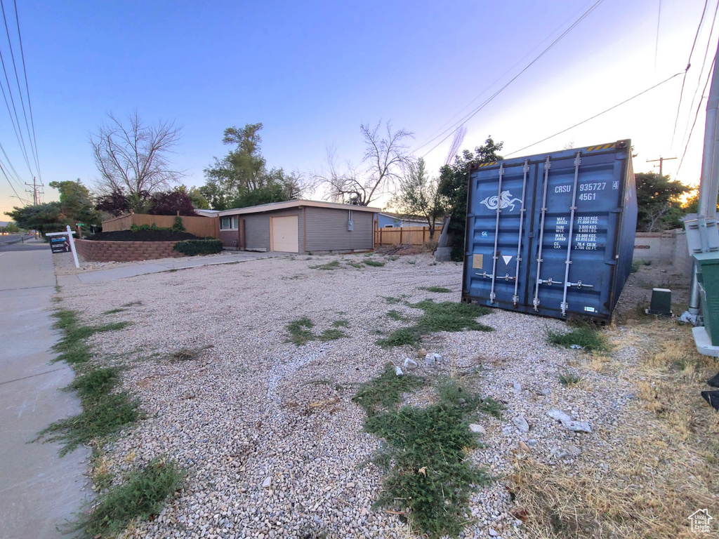 View of yard at dusk