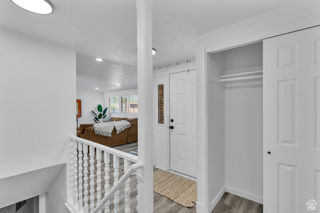 Foyer entrance featuring hardwood / wood-style floors