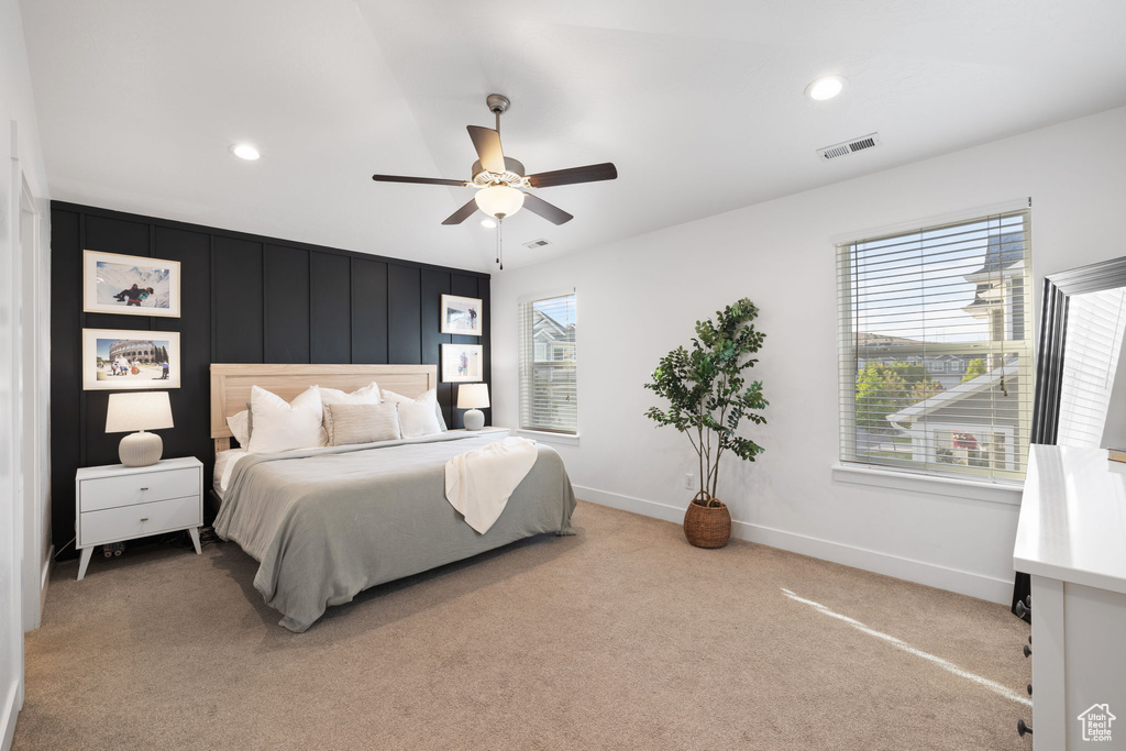 Bedroom featuring ceiling fan and carpet floors