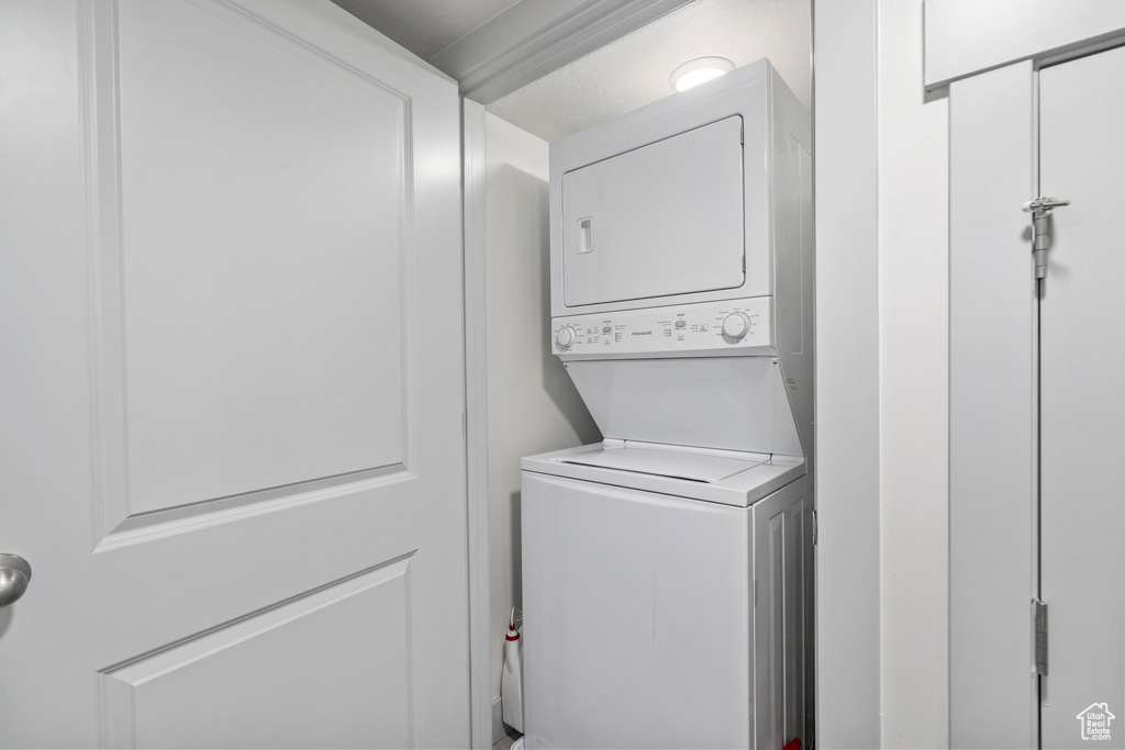 Washroom with stacked washer / drying machine