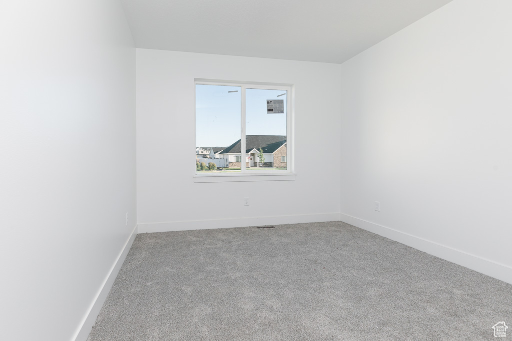 View of carpeted spare room